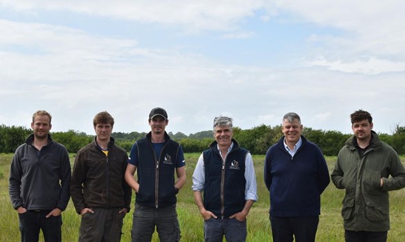 Common Barn Farm team standing in their field.
